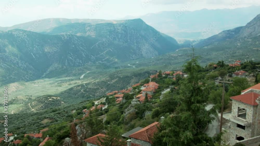 a scenic view of arachova in greece. mountains in the background. establishing shot. a scenic view of arachova in greece. mountains in the background. establishing shot.