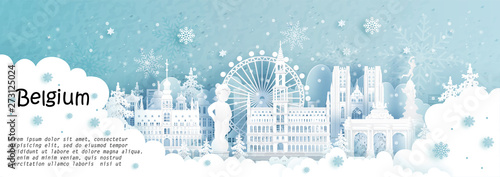 Panorama postcard and travel poster of world famous landmarks of Brussels, Belgium in winter season with falling snow in paper cut style vector illustration