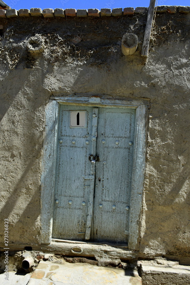 Old wooden door in the old town of Bukhara, Uzbekistan