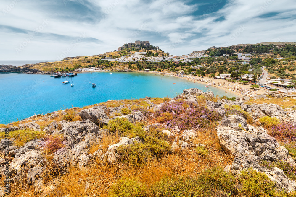 Famous tourist attraction and landmark - Lindos town landscape. Travel and vacation destination in Rhodes island, Greece.