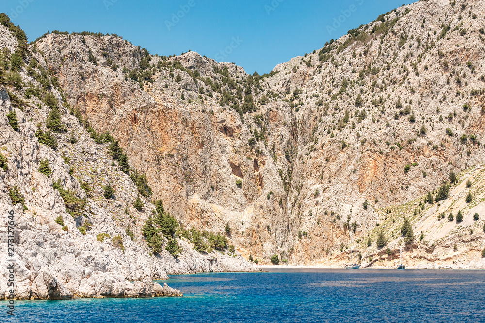 Picturesque St. George Bay with Rocky Cliffs in Symi island, Greece