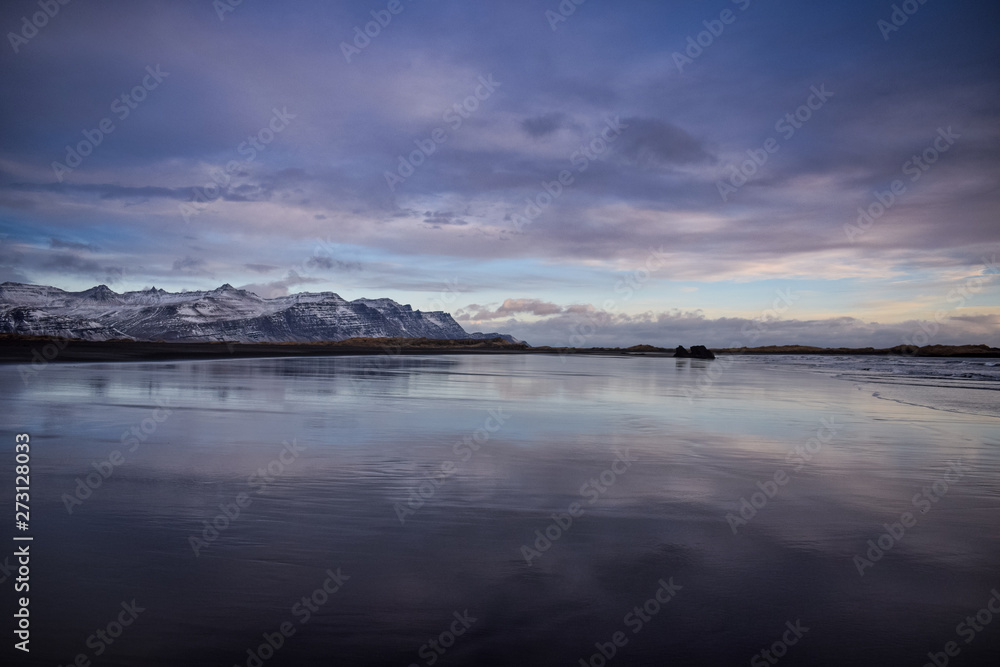  Iceland natural landscape in winter with snowy mountains and a nice river.