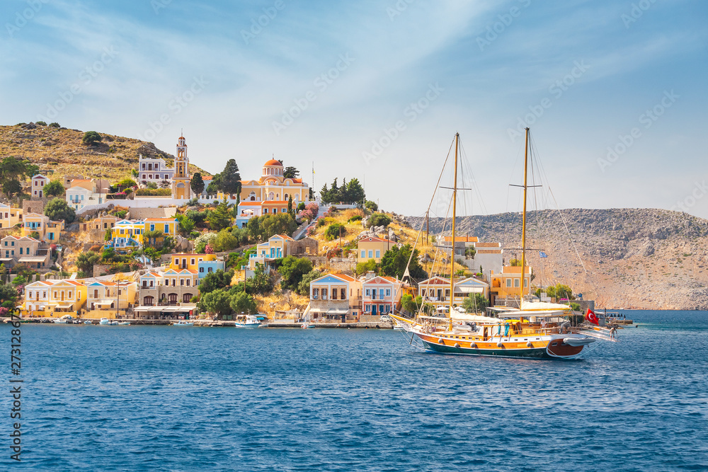 Scenic vivid seascape of a Greek island of Symi in the Dodecanese, Greece . Popular tourist attraction