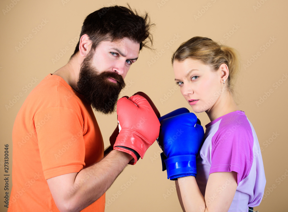 Couple girl and hipster practicing boxing. Sport for everyone. Amateur boxing club. Equal possibilities. Strength and power. Man and woman in boxing gloves. Be careful. Boxing sport concept
