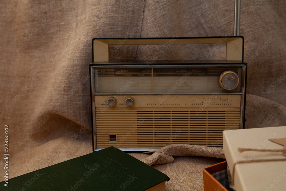 old soviet tape recorder on a flax texture background