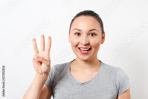 Wallpaper Mural Beauty holding up three fingers, portrait Torontodigital.ca