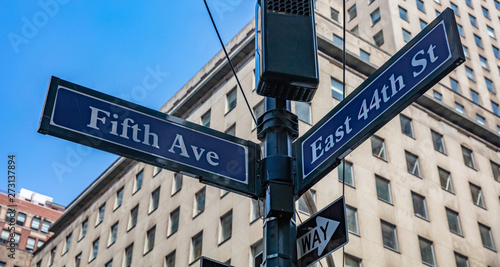 5th ave and E44 corner. Blue color street signs, Manhattan New York downtown