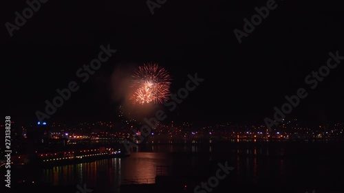 Wallpaper Mural Fireworks in the night sky over the city with a sea bay. Outbreaks of salute in the night sky. Fireworks over the city. City salute from a height. Torontodigital.ca