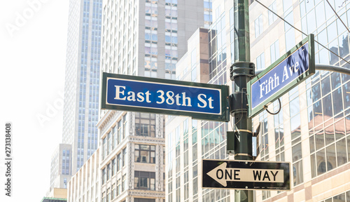 5th ave and E38 corner. Blue color street signs, Manhattan New York downtown