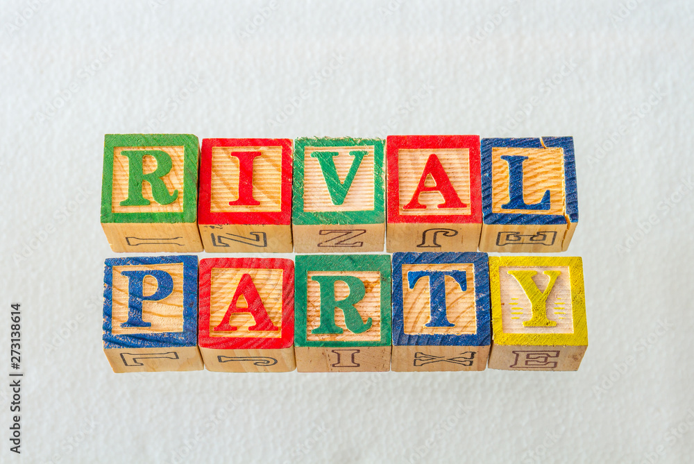 The term rival party visually displayed on a clear background using colorful wooden blocks image in landscape format The term rival party visually displayed on a clear background using colorful wooden blocks image in landscape format