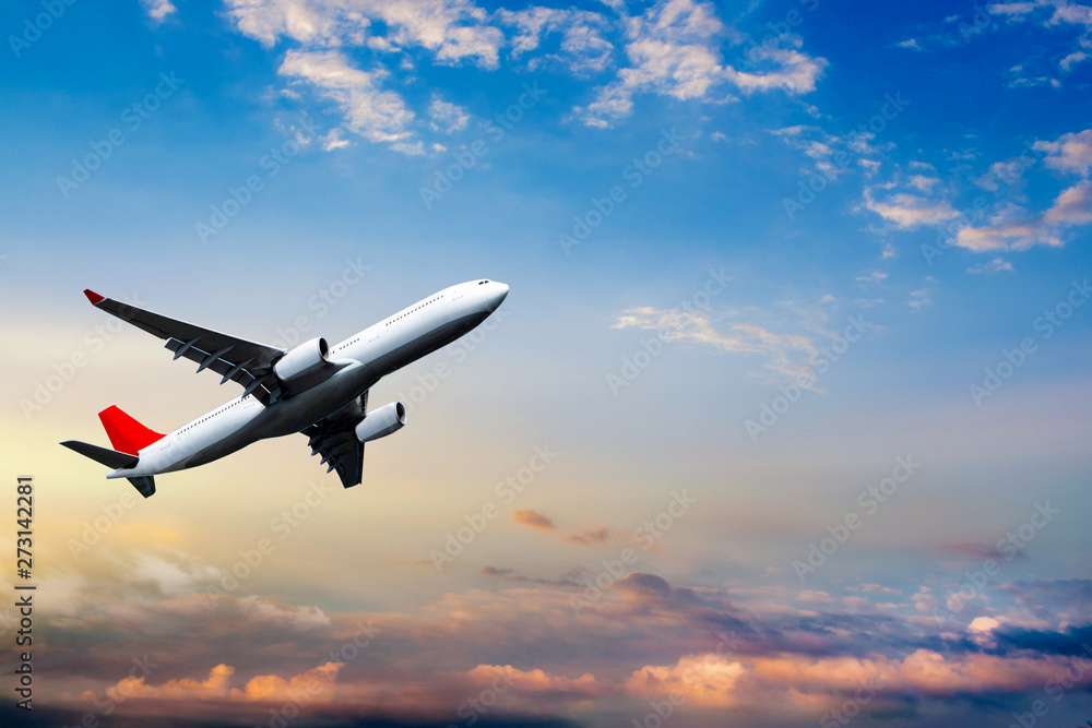 Airplane in the sky at sunrise . Plane Background Blue Sky White Clouds Airplane in the sky at sunrise . Plane Background Blue Sky White Clouds