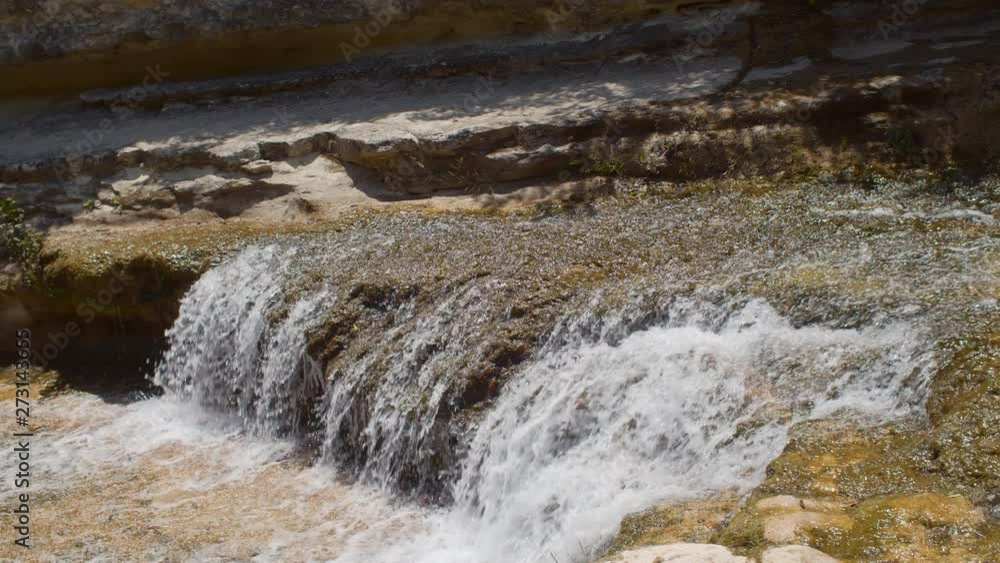 A PANNING SHOT of a beautiful waterfall in SLOW MOTION. A PANNING SHOT of a beautiful waterfall in SLOW MOTION.