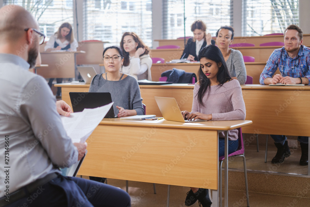 Multinational group of students in an auditorium