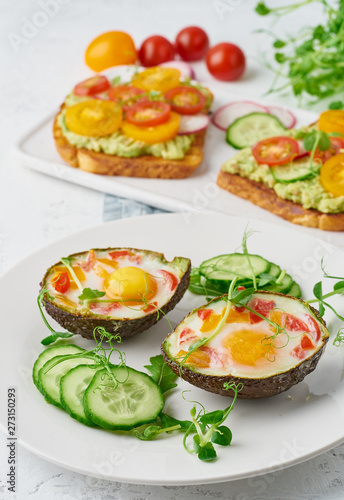 egg baked in avocado, toast, breakfast, closeup