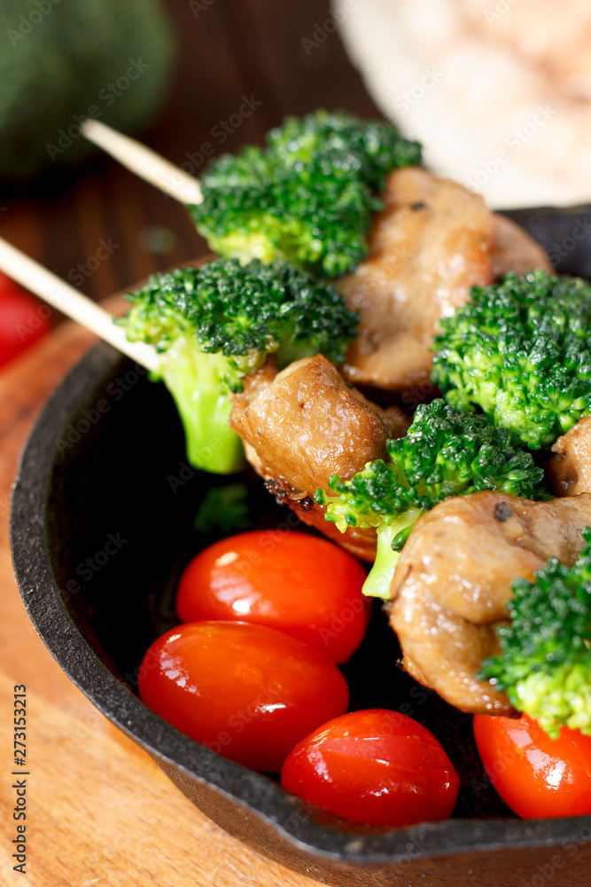 Vegan kebabs with seitan and broccoli on wooden skewers. Vegan kebabs with seitan and broccoli on wooden skewers.