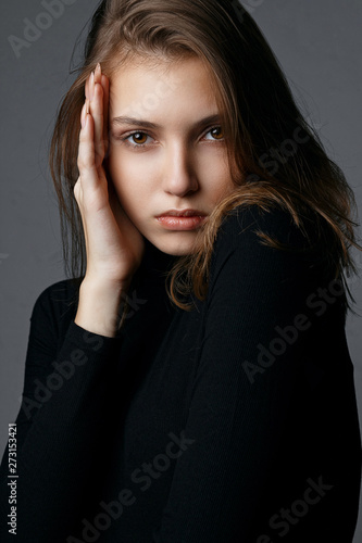 Test shooting for glorious young model with natural makeup wearing black sweater