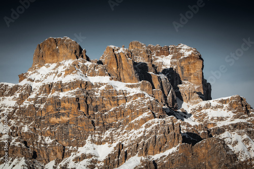 view on scenic snowy mountain range landscape in sunlight, view from monte piana in dolomites, italy