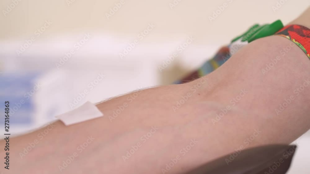 Hands of nurse collecting blood sample from a vein of little patient in the hospital. Medical concept. Close-up, isolated. Hands of nurse collecting blood sample from a vein of little patient in the hospital. Medical concept. Close-up, isolated.