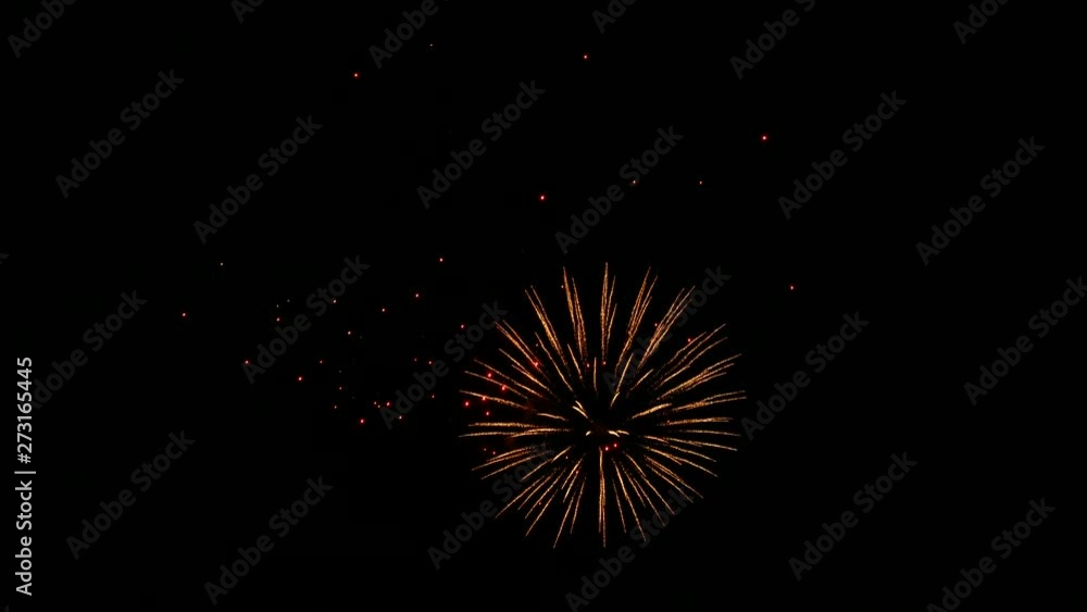 Fireworks fly in the sky. Solemn firing of blank charges from artillery shells, the tradition of military parades. Multicolored firework explosions. Fireworks fly in the sky. Solemn firing of blank charges from artillery shells, the tradition of military parades. Multicolored firework explosions.