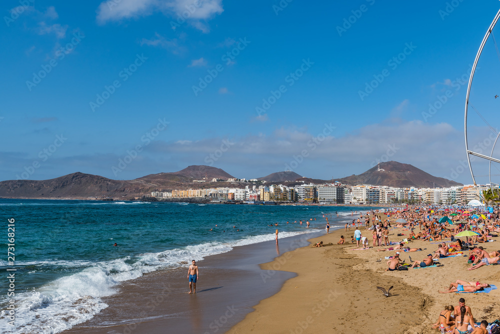 LAS PALMAS DE GRAN CANARIA, CANARY ISLANDS, SPAIN - OCTOBER 03, 2010: View of the beach Playa Las Canteras. Copy space for text. LAS PALMAS DE GRAN CANARIA, CANARY ISLANDS, SPAIN - OCTOBER 03, 2010: View of the beach Playa Las Canteras. Copy space for text.