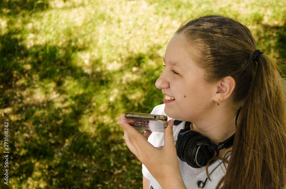 A young girl talking on the phone. A young girl talking on the phone.