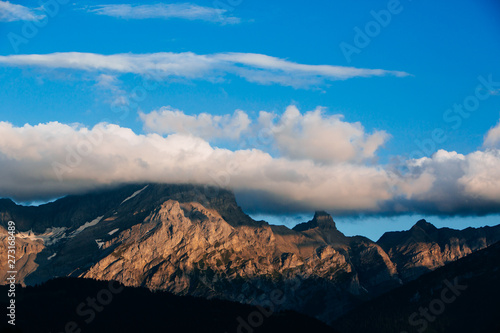 Blanket of cloud hovering over mountain top