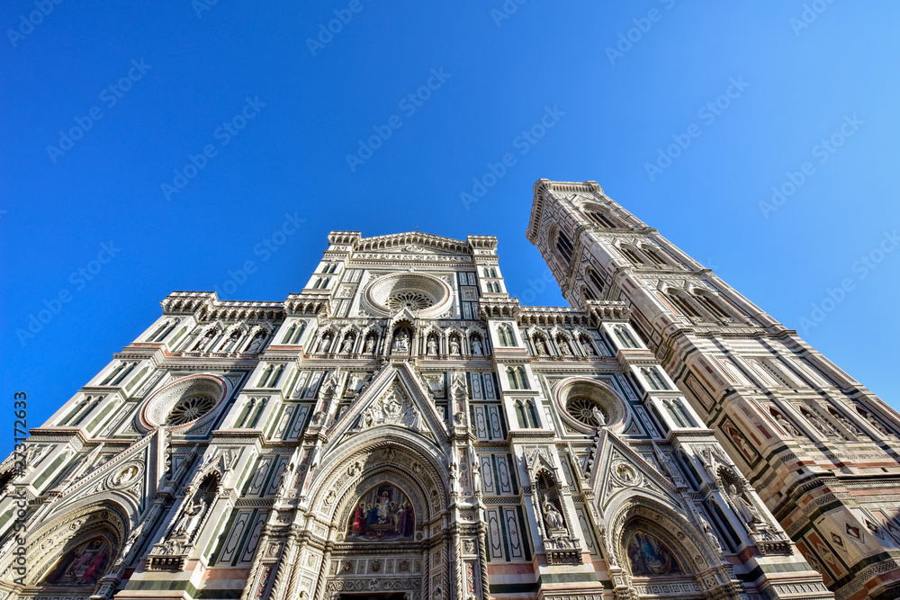 Giotto's Campanile and Cathedral of Santa Maria del Fiore in the Piazza del Duomo. Florence. Italy. Bottom up view. 