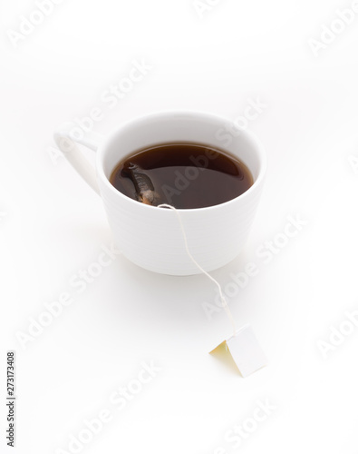 black tea in white cup on isolated white background