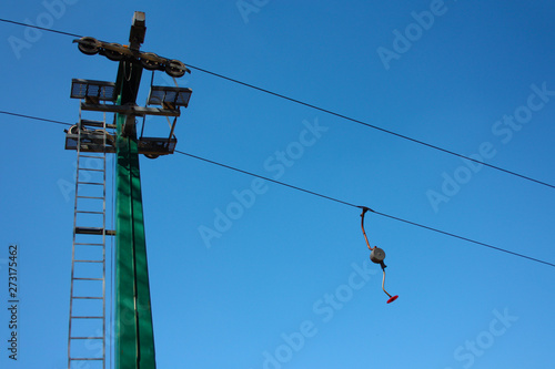 ski lift or skilift. cable car pole on snow slope in summer. photo