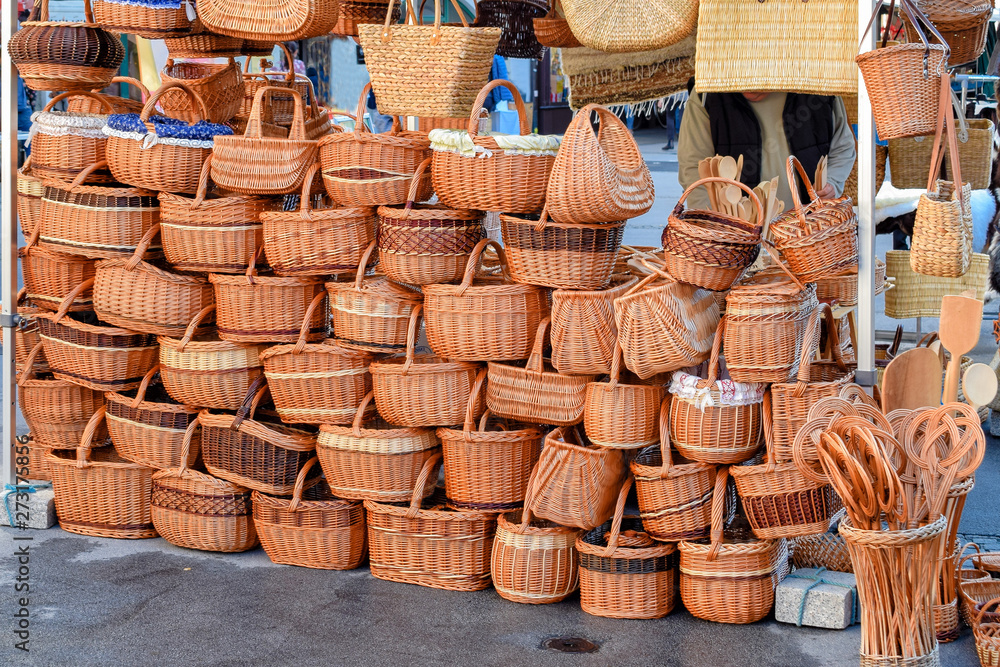 A wall of wicker baskets and handbags at market in Europe