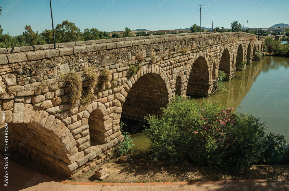 Fototapeta premium The ancient long bridge still in use over the Guadiana River at Merida