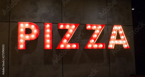 A sign for Pizza