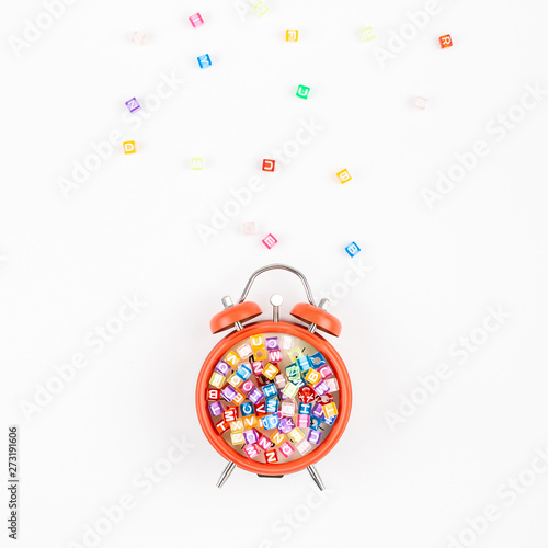 Alarm clock and multicolor alphabet