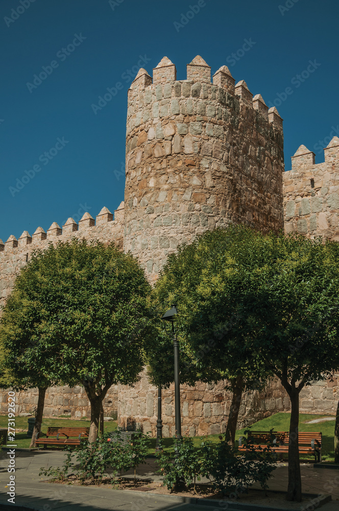 Tower on wall next to wooden garden at Avila