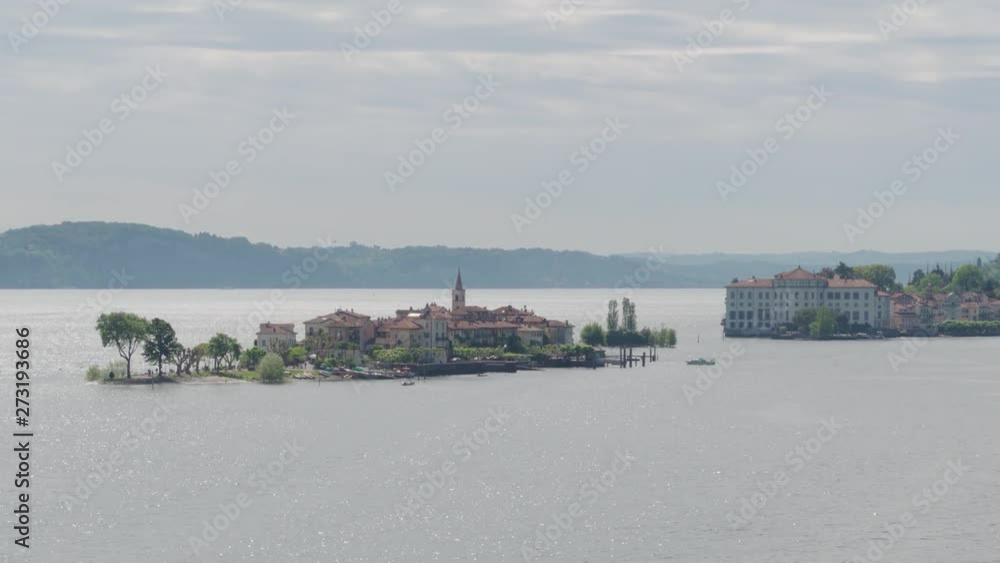 Aerial fast travel shot of the borromean islands in the lake lago maggiore on a bright summer day. Aerial fast travel shot of the borromean islands in the lake lago maggiore on a bright summer day.