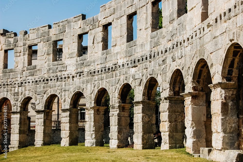 Pula, Croatia - June 1, 2019: Walls of the ruins of the Pula Coliseum.