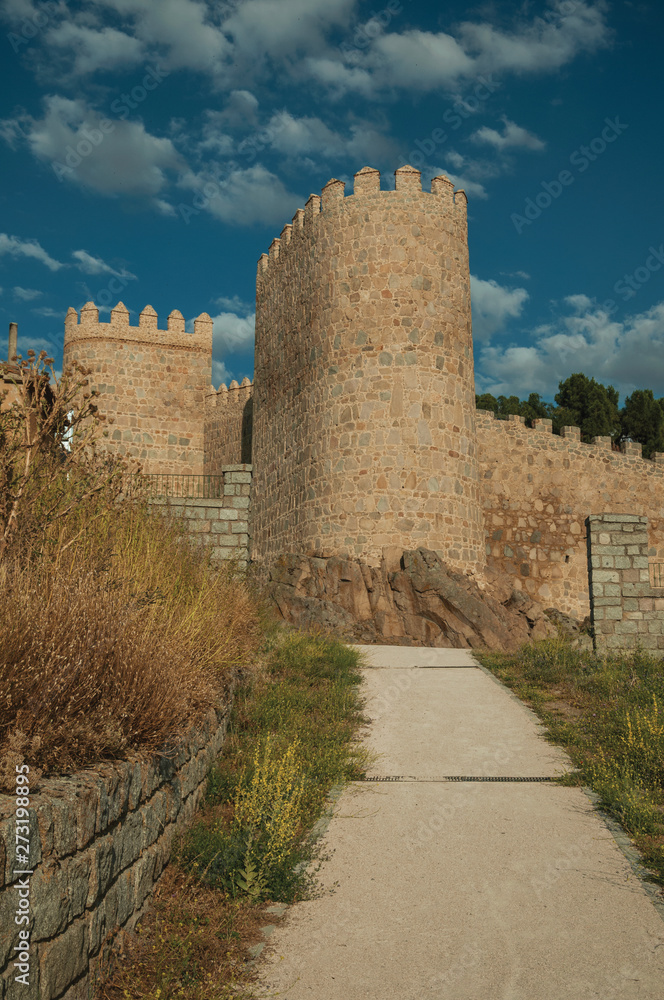 Pathway and stone towers in the large wall of Avila