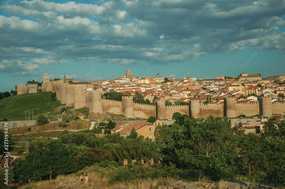 Stone towers with large wall encircling the city of Avila