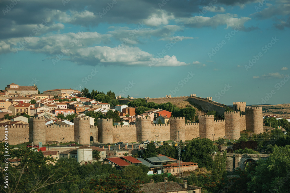 City landscape with large stone wall and towers at Avila