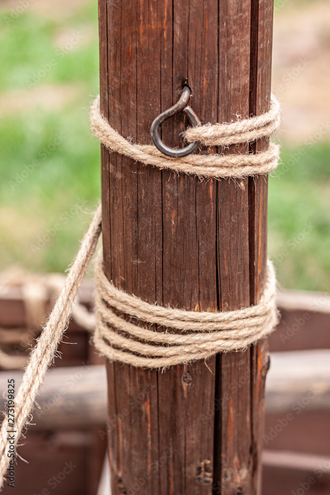 Rope wound around a wooden post