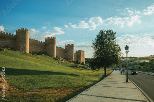 Street and stone towers in the large wall encircling the town of Avila