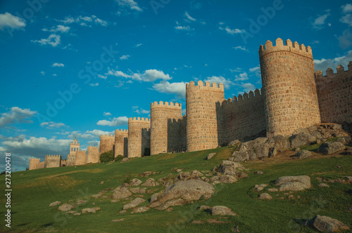 Stone towers over rocky landscape encircling the town of Avila