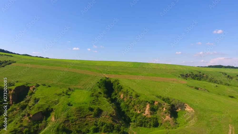 Aerial view of green natural hill field with grass Aerial view of green natural hill field with grass