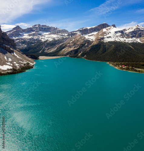 Aerial panoramic view of the scenic Bow Lake with a reflection of the mountains on the Icefields Parkway in Banff National Park and Jasper National Park photo