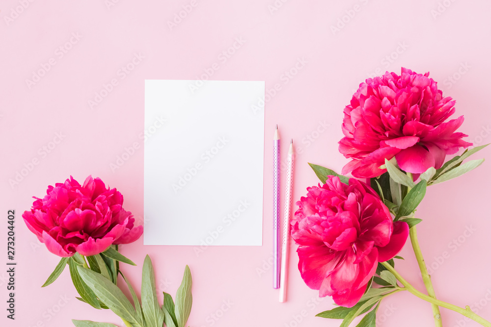 Mockup white greeting card with red peonies on a pink background