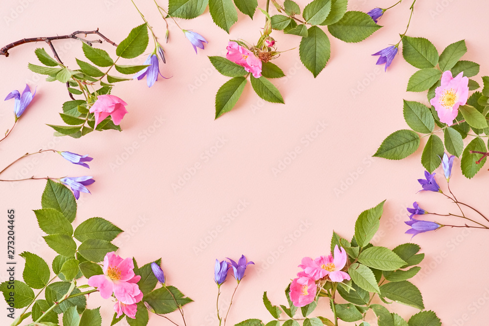 Flat lay composition with pink flowers on a pink background Flat lay composition with pink flowers on a pink background