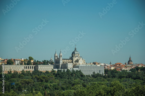 Royal Palace and Almudena Cathedral with trees in Madrid © Celli07