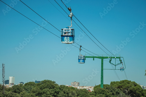 Cable car gondola and big supporting towers at the Teleferico Park of Madrid