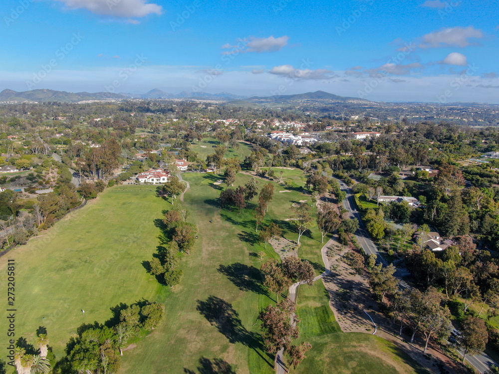 Aerial view of a beautiful wealthy green golf course next the valley. San Diego, California. USA. 