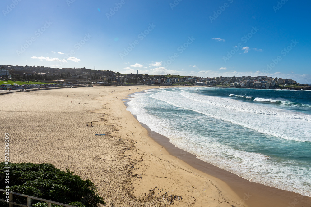 Bondi Beach, Sydney, Australia - January 24, 2015: Tourists and swimmers relaxing on the beach in summer at Bondi Beach